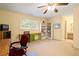 Spacious bedroom with a workstation, vanity and natural light coming in from the window at 7098 Stonington Dr, Atlanta, GA 30328