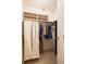 Walk-in closet includes shelving and space for hanging clothes at 7098 Stonington Dr, Atlanta, GA 30328