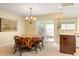 Cozy dining area with natural light and an adjacent patio, offering a seamless transition to outdoor living at 7098 Stonington Dr, Atlanta, GA 30328