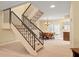 Charming dining area with a staircase featuring black railings, perfect for entertaining Gathering and friends at 7098 Stonington Dr, Atlanta, GA 30328