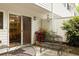 Outdoor patio with a sliding glass door and wrought iron benches and chairs at 7098 Stonington Dr, Atlanta, GA 30328