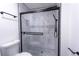 Modern bathroom featuring black and white tile, and a glass enclosed shower at 1111 Osborne Sw St, Atlanta, GA 30310