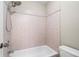 This bathroom offers neutral paint, a shower-tub combo, and neutral tiling at 1459 Hickory Branch Nw Trl, Kennesaw, GA 30152