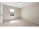 This carpeted bedroom offers neutral paint, and a window at 1459 Hickory Branch Nw Trl, Kennesaw, GA 30152