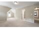 This carpeted bonus room offers neutral paint, multiple windows, and recessed lights at 1459 Hickory Branch Nw Trl, Kennesaw, GA 30152