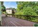 Large wood deck with beautiful treeline views offering a serene outdoor retreat at 1459 Hickory Branch Nw Trl, Kennesaw, GA 30152