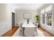 Bright dining room featuring hardwood floors, modern decor, and large windows for natural light at 1459 Hickory Branch Nw Trl, Kennesaw, GA 30152