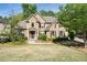 Beautiful two-story brick home with a stone facade and manicured landscaping at 1459 Hickory Branch Nw Trl, Kennesaw, GA 30152