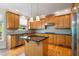 Well-equipped kitchen featuring an island, stainless steel appliances, and hardwood floors at 1459 Hickory Branch Nw Trl, Kennesaw, GA 30152