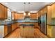 Updated kitchen featuring stainless steel appliances, a central island, and hardwood floors at 1459 Hickory Branch Nw Trl, Kennesaw, GA 30152