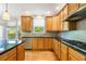 Spacious kitchen with stainless steel appliances, granite countertops, and ample cabinet space at 1459 Hickory Branch Nw Trl, Kennesaw, GA 30152