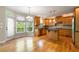 Open kitchen with island, stainless appliances, and breakfast area with deck access at 1459 Hickory Branch Nw Trl, Kennesaw, GA 30152