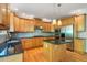Bright kitchen featuring stainless steel appliances, a functional island, and hardwood floors at 1459 Hickory Branch Nw Trl, Kennesaw, GA 30152