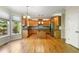 Open kitchen with island, stainless steel appliances, and breakfast nook with backyard views at 1459 Hickory Branch Nw Trl, Kennesaw, GA 30152