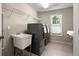 This laundry room offers storage, a utility sink, and updated appliances at 1459 Hickory Branch Nw Trl, Kennesaw, GA 30152