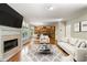 Spacious living room features hardwood floors, fireplace, and large windows at 1459 Hickory Branch Nw Trl, Kennesaw, GA 30152