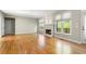 Hardwood floors, fireplace, natural lighting, in large living room with neutral colors at 1459 Hickory Branch Nw Trl, Kennesaw, GA 30152