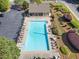 Relaxing community pool with lounge chairs and beautiful landscaping, perfect for sunny afternoons at 1459 Hickory Branch Nw Trl, Kennesaw, GA 30152