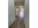 Inviting entryway showcasing modern wood floors, neutral paint, and arched doorways leading to various living spaces at 290 Azalea Cir, Cumming, GA 30040