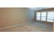 Neutral bedroom with carpet, large windows allowing ample natural light, and base trim at 4208 Royal Regency Nw Cir # 9, Kennesaw, GA 30144