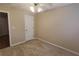 This bedroom is painted in neutral tones and has a ceiling fan at 4208 Royal Regency Nw Cir # 9, Kennesaw, GA 30144