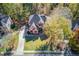 Aerial view of a lovely home with a tree-lined yard at 445 Big Bend Trl, Sugar Hill, GA 30518