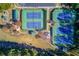 Aerial view of four tennis courts alongside a playground and a covered picnic area at 445 Big Bend Trl, Sugar Hill, GA 30518