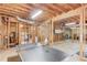 Spacious unfinished basement features recreational area with ping pong and space for storage at 445 Big Bend Trl, Sugar Hill, GA 30518