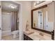Bathroom featuring tiled floors and a combined shower-tub at 445 Big Bend Trl, Sugar Hill, GA 30518