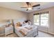 Comfortable bedroom with neutral walls and a ceiling fan at 445 Big Bend Trl, Sugar Hill, GA 30518