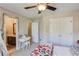 Bedroom with decorative vanity near the closet and an ensuite bathroom at 445 Big Bend Trl, Sugar Hill, GA 30518