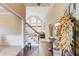 Bright foyer with hardwood floors, staircase, and high ceilings at 445 Big Bend Trl, Sugar Hill, GA 30518
