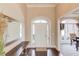 Welcoming foyer with hardwood floors and views into the dining room at 445 Big Bend Trl, Sugar Hill, GA 30518