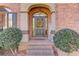 Charming front entryway with brick steps, columns, and a decorative wreath at 445 Big Bend Trl, Sugar Hill, GA 30518