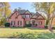 Charming two-story brick home with manicured lawn and landscaping at 445 Big Bend Trl, Sugar Hill, GA 30518