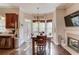 Kitchen dining area with outside deck access and fireplace at 445 Big Bend Trl, Sugar Hill, GA 30518