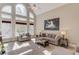 Bright living room with a wall of windows and comfortable seating at 445 Big Bend Trl, Sugar Hill, GA 30518