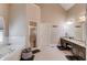Well-lit bathroom features double vanity, soaking tub, and step-in shower at 445 Big Bend Trl, Sugar Hill, GA 30518