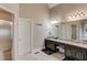 Well-lit bathroom features double vanity, step-in shower and neutral walls at 445 Big Bend Trl, Sugar Hill, GA 30518
