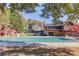 Community pool covered for the off-season next to the clubhouse, playground, and picnic area at 445 Big Bend Trl, Sugar Hill, GA 30518