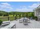 Relaxing deck area with outdoor seating and a picturesque view of the lush green landscape at 639 Puckett Se Rd, Emerson, GA 30137