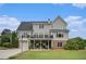 Expansive backyard showcasing a two-story home with a deck, patio, and lush green lawn at 639 Puckett Se Rd, Emerson, GA 30137
