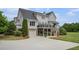 Spacious backyard view with a garage, a patio, and a deck with an outdoor seating area at 639 Puckett Se Rd, Emerson, GA 30137