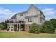 Backyard view featuring a multi-level deck, cozy patio, and a well-maintained lawn at 639 Puckett Se Rd, Emerson, GA 30137