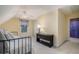 Comfortable bedroom with a daybed, neutral carpet, ceiling fan, and natural light at 639 Puckett Se Rd, Emerson, GA 30137