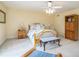 Sunny bedroom with a ceiling fan, wooden bed, and wooden armoire at 639 Puckett Se Rd, Emerson, GA 30137