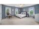 Well-lit bedroom featuring a king bed, carpeting, and large windows at 639 Puckett Se Rd, Emerson, GA 30137