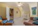 Cozy bedroom featuring a seating area, cabinet, and a window with natural light at 639 Puckett Se Rd, Emerson, GA 30137