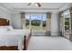 Bright bedroom with a large window view of the backyard at 639 Puckett Se Rd, Emerson, GA 30137