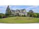 Beautiful home with a large front lawn and mature trees at 639 Puckett Se Rd, Emerson, GA 30137